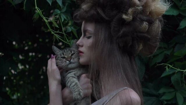 Slow Motion mystic style fabulous forest with nymph long dark hair with a cat 