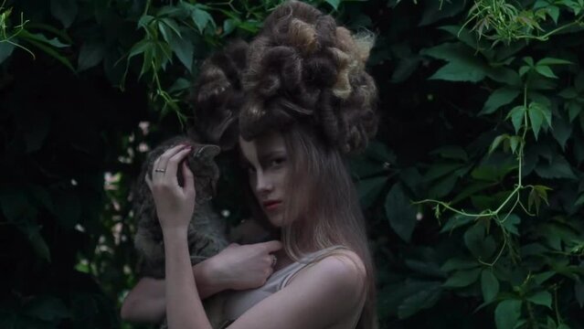 Slow Motion mystic style fabulous forest with nymph long dark hair with a cat 