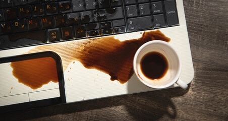 Coffee spilled over laptop keyboard.