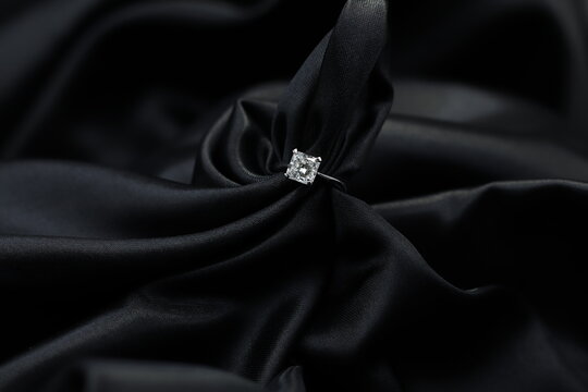 Fine Jewelry As Diamond Ring With Diamond With Black Satin Fabric Background. Jewelry Shop Concept