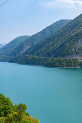 Naklejka na ściany i meble bare lake between the mountains and blue sky