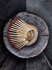 matches on a wooden round stand