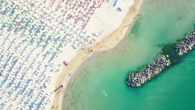 Beach and rocks depicted by drone on the Adriatic Riviera in Italy