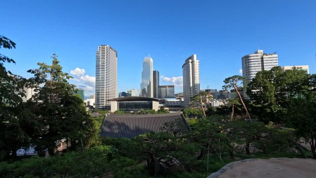 Seoul city skyline with low clouds movement from Bongeunsa Temple, Trade Tower and Coex , Intercontinental Hotel and Asem Tower buildings exteriors in background