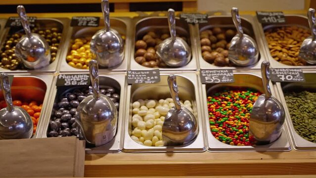 Assortment of peeled and candied seeds and nuts in the store