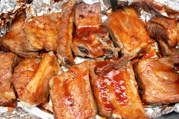 Pork ribs baked in barbecue sauce in the oven