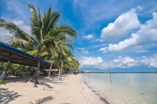 White sand and calm, shallow waters at Tondol Beach, in Anda, Pangasinan, Philippines.