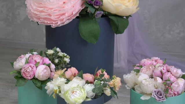 Slow Motion beautiful flower arrangement in a hat box