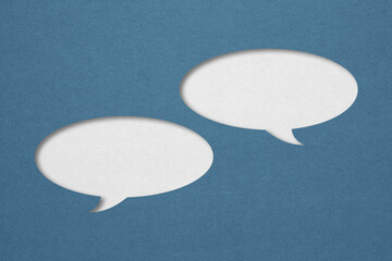blue  speech bubble paper cut on white paper background