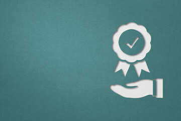 guarantee sign over businessman's hand paper cut with blue background including clipping path