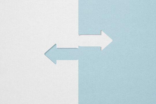 opposite directions arrow paper cut grey and blue with copy space