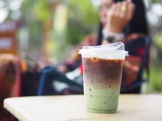 Iced coffee mixed with orange juice, two tones layer decoration.