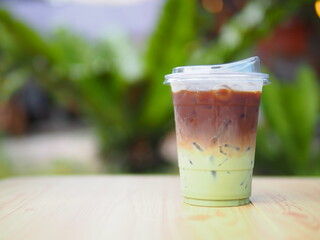 Iced coffee mixed with orange juice, two tones layer decoration.