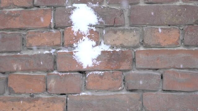 Slow Motion Snowball Splat On The Snowy Brick Wall.