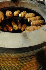 A Furnace Of Charcoal Roasted Sweet Potatoes	