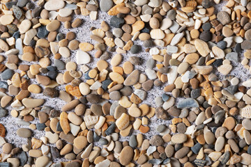 Texture of small stones for design on a summer theme