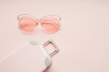 Pink sunglasses and with pink bag. Summer travel concept