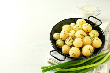 Concept of tasty food with boiled young potatoes, space for text