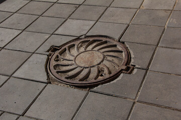 Old cast iron manhole cover