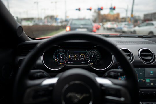 Wroclaw, Poland - January 28, 2020: Dashboard of Ford Mustang GT in traffic. Detailed shot of digital display speedometer.