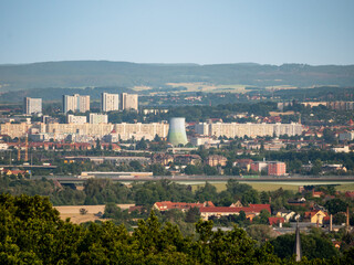 Cityscape of Dresden in Saxony. View into the inner city with a lot of huge residential buildings for many people. The big cooling tower of the local energy provider stands out.