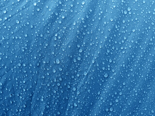 Obraz premium Water drops on waterproof membrane fabric. Morning dew on tent.