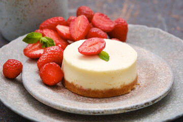Cheesecake with strawberries. Shallow depth of field