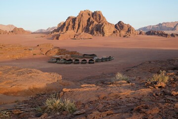 Amazing scenery of Wadi Rum desert. Bedouin tents for tourists in valley. 