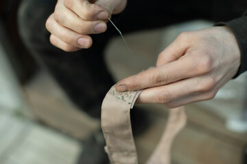 Obraz na płótnie Canvas Sewing tape. Collar stitching in army. Work of weaver.