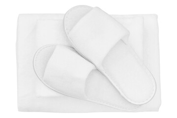 Spa, hotel, wellness, home pair of slippers with rolled towel isolated