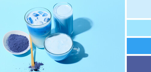 Glassware of blue matcha tea on color background. Different color patterns