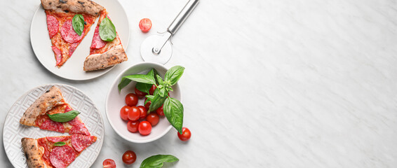 Composition with tasty cut pepperoni pizza and ingredients on light background with space for text