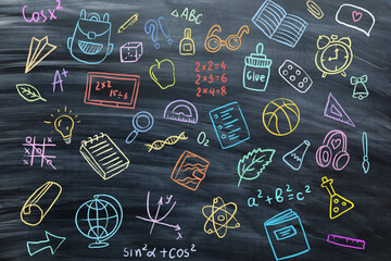 Many different drawings on school blackboard