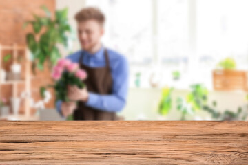 Empty wooden table in flower shop