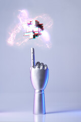 Mechanical robot arm or hand interacts with futuristic digital technologies.