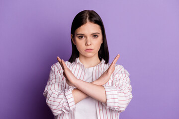 Photo of young girl crossed hands show forbidden rule symbol decline isolated over violet color background