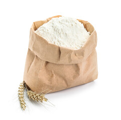 Wheat ears and paper bag with flour on white background
