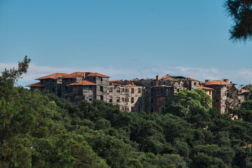 Fototapeta na wymiar Prinkipo Greek Orthodox Orphanage wide view from hill, abandoned and brownfield biggest wooden made building