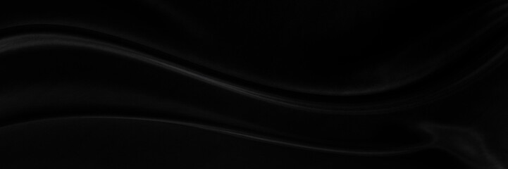 Black gray satin dark fabric texture luxurious shiny that is abstract silk cloth background with patterns soft waves blur beautiful.