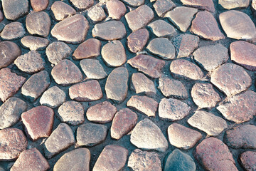 Pavement made of stones as a background.