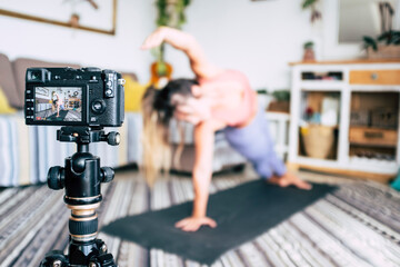 Fitness and home gym workout exercises production from content creator. Concept of healthy job and lifestyle work. People record on camera a pilates fitness lesson. Modern technology freelance work