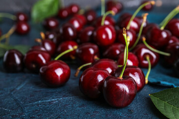 Ripe cherry on dark color background, closeup