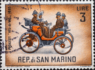 SAN MARINO - CIRCA 1962: a postage stamp from SAN MARINO , showing a Classic Automobile Peugeot...