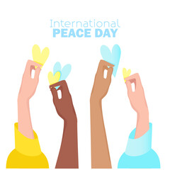 International peace day Women's hands of different skin colors hold yellow and blue hearts in support of Ukraine