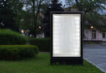 blank advertising lightbox on night city square