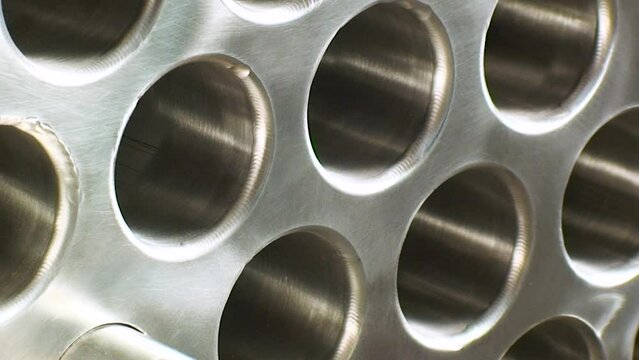 Condenser, evaporator, heat exchanger, inside tube pattern. Cooling tower making. Zoom out.