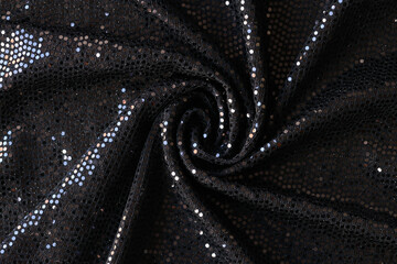 Black cloth with shiny sequins abstract background