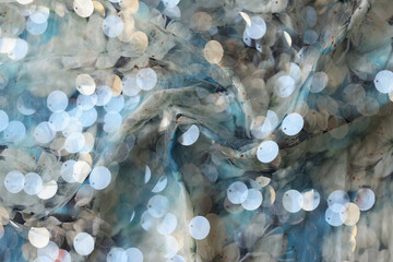 Cloth with shiny silver sequins abstract background