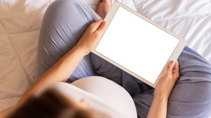Pregnancy digital tablet mockup. Pregnant woman holding smart tablet. Mobile pregnancy online maternity application mock up. Concept of pregnancy, maternity, expectation for baby birth.