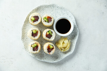 Obraz na płótnie Canvas Sushi rolls with tuna and avocado